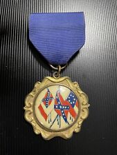 Civil war medal highlighting southern flags with gold color trim and blue ribbon picture