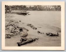WW2 American soldiers dead on a beach photo.  Top of sol head blown off picture