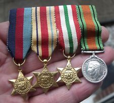 A WW2 MINIATURE FOUR MEDAL GROUP, 1939, AFRICA, ITALY STARS, DEFENCE MEDAL. picture