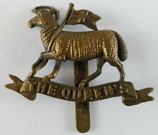 WW1 Genuine Brass Economy Badge The Queens Regiment - front legs bent / repair picture