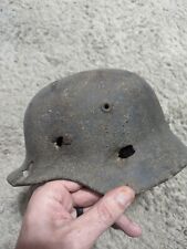 WW2 German Luftwaffe M40 battle damaged helmet picture