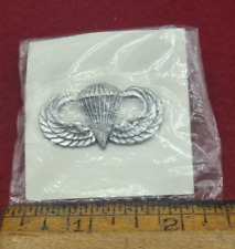Desert Storm era US Army paratrooper badge in silver full-size on card picture