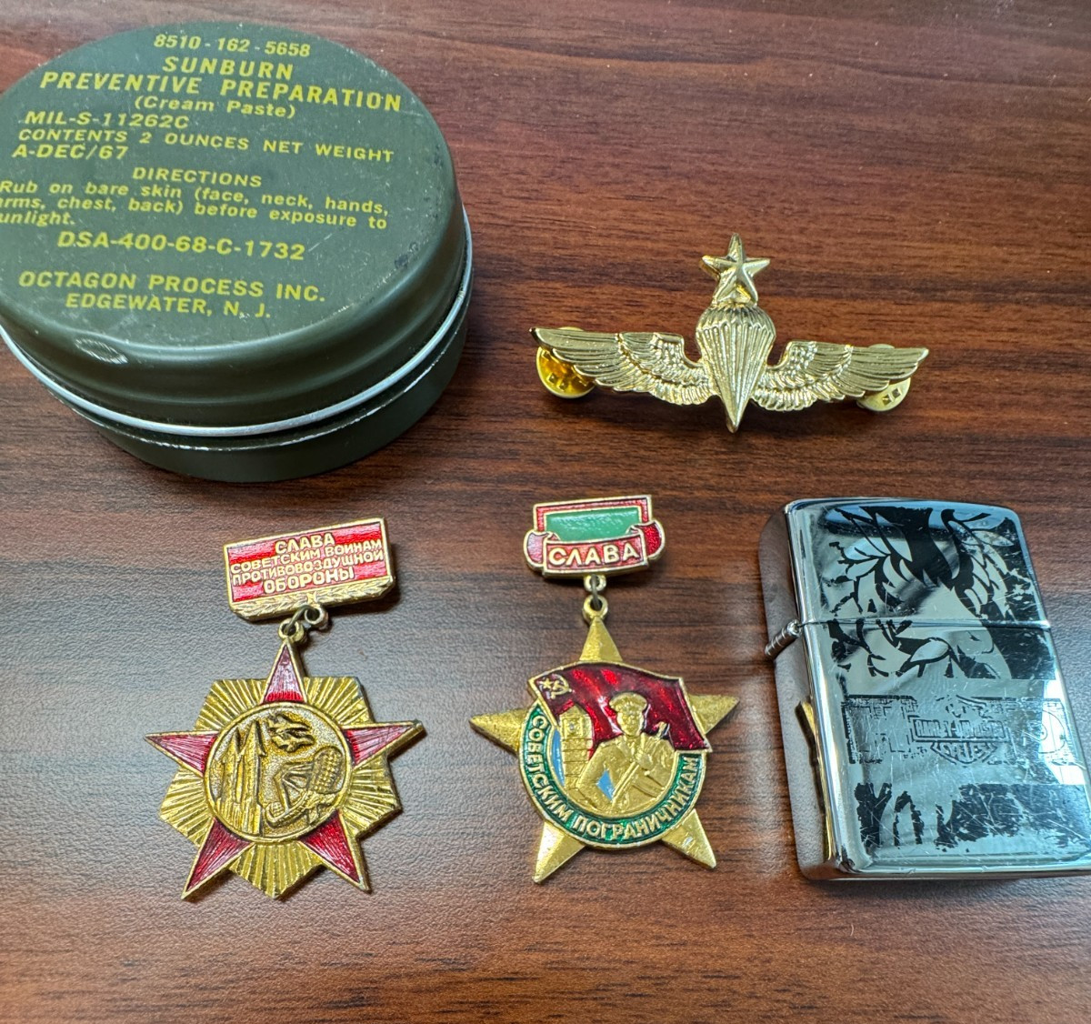 Junk Drawer, Soviet Pins, Used Zippo, Vietname Sunburn cream, us reproductio pin