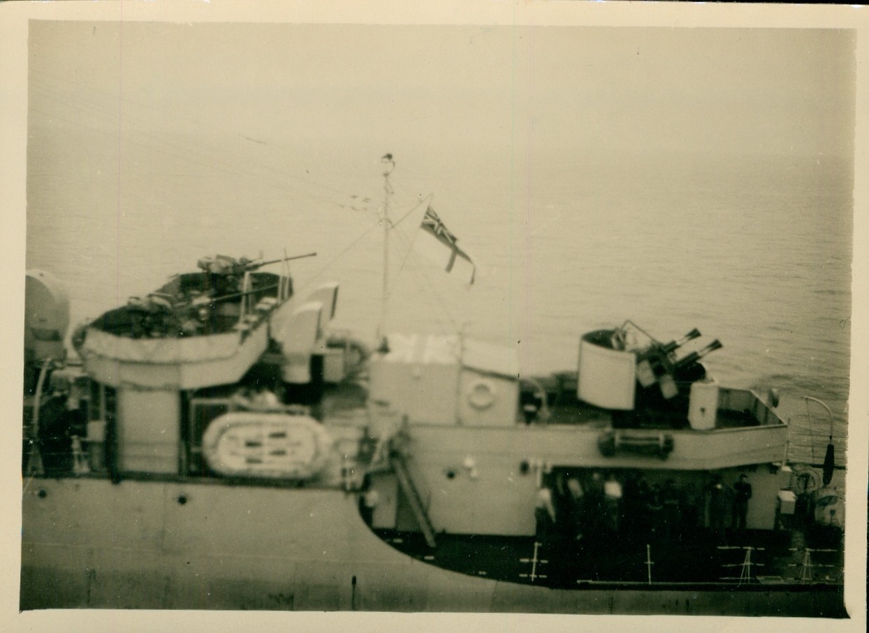1940s WWII US Navy sailors of British ship alongside at ? Photo