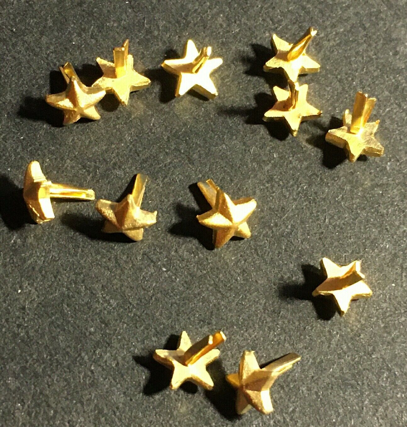Lot of 12 Gold Stars ribbon/medal attachments gold surface 3/16