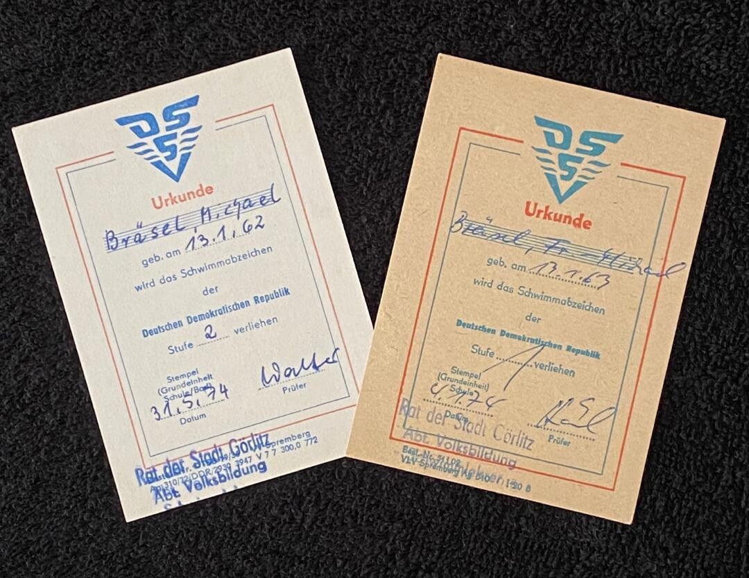 2 Vintage East German DDR SILVER & BRONZE SWIM AWARD URKUNDE CERTS. SAME Person