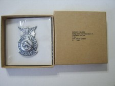 USAF FIRE PROTECTION FIRE FIGHTER BADGE MINI SIZE IN GI BOX OF IN SEALED PACK
