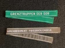 TWO East German DDR GRENZTRUPPEN & WACHREGIMENT F. ENGELS CUFFTITLES Mint