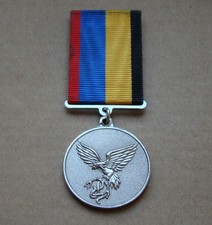 A participant in the ATO anti-terrorist operation in Donbas war in Ukraine medal