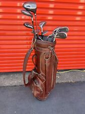 Vintage brown leather bag with golf clubs picture