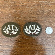 Pair Of British Army "AT" (Anti-Tank) trade or qualification badges